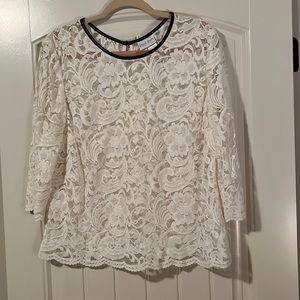 Beautiful ivory lace top with button closure on back and trimmed with leather